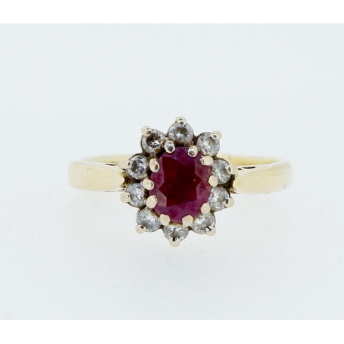 414 - An 18 carat gold ruby and diamond cluster ring, size N, 3.9g