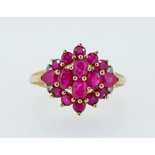 416 - A 9 carat gold ruby cluster ring with chip diamonds to shoulders, 3.4g, size P to Q