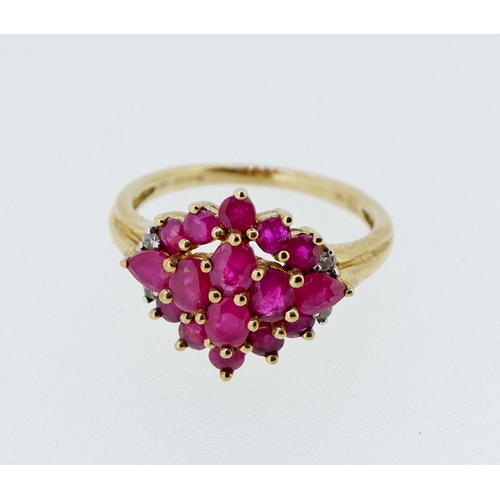 416 - A 9 carat gold ruby cluster ring with chip diamonds to shoulders, 3.4g, size P to Q