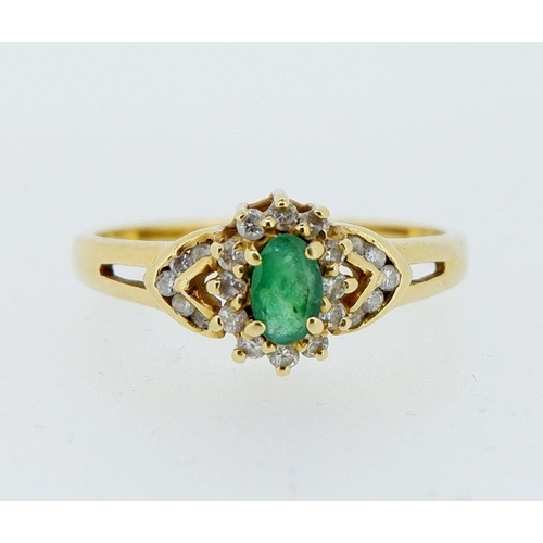 419 - An 18 carat gold ring set emerald within diamond surround and on diamond set shoulders, 3g, size P