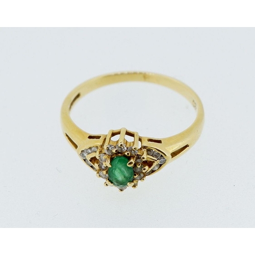 419 - An 18 carat gold ring set emerald within diamond surround and on diamond set shoulders, 3g, size P