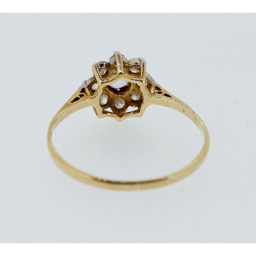 421 - A 9 carat gold cubic zirconium cluster ring, size N, 1.3g