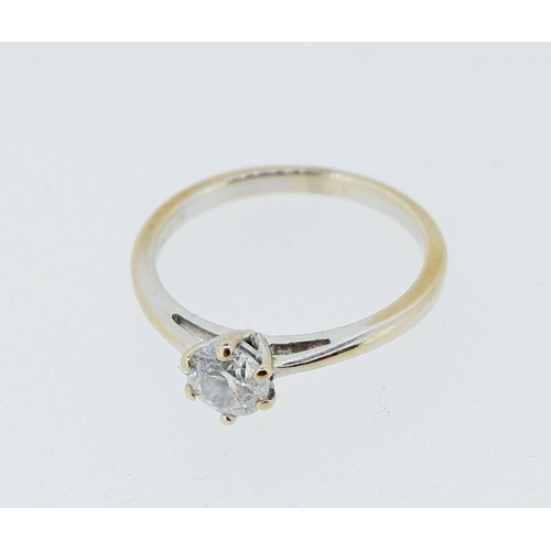 423 - An 18 carat gold solitaire diamond ring, size I to J, 2.2g