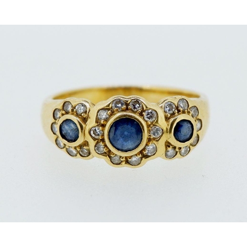 424 - An 18 carat gold ring set triple sapphire and diamond cluster, size N, 4.4g