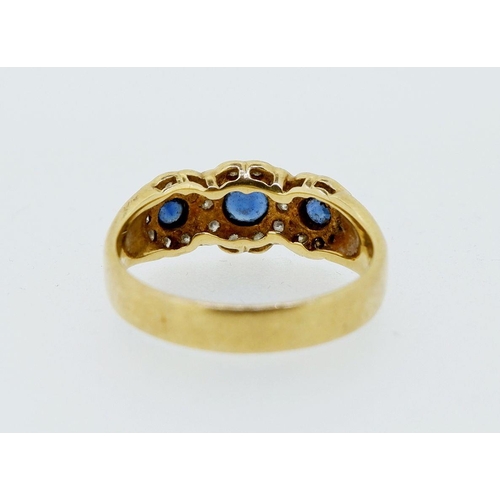 424 - An 18 carat gold ring set triple sapphire and diamond cluster, size N, 4.4g