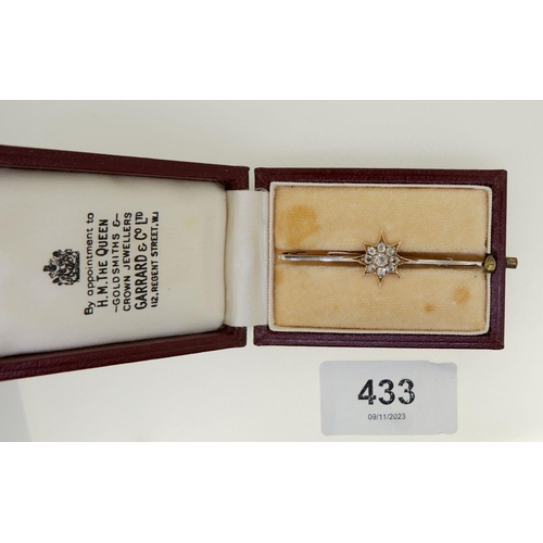 433 - An antique 18 carat and 15 carat white and yellow gold bar brooch with diamond set star and safety c... 