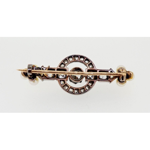 443 - An antique diamond and pearl brooch, the central stone approx 1/2 carat, 7g, 4.5cm