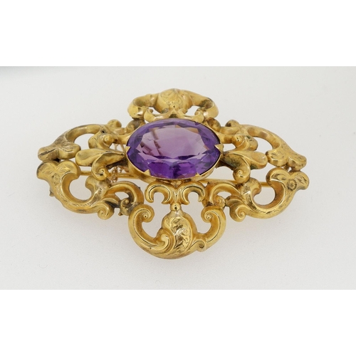 444 - A Victorian gold amethyst brooch with safety chain, unmarked but tested as 15ct gold or higher, 6cm ... 