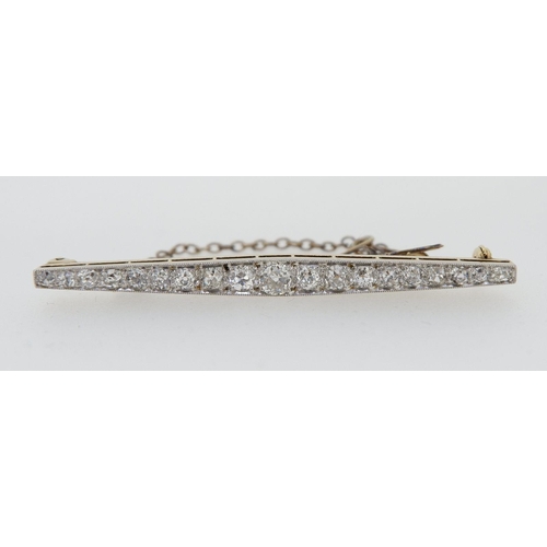 446 - A 14 carat gold bar brooch set nineteen graduated diamonds ranging from 3.5mm to 1.73mm with safety ... 