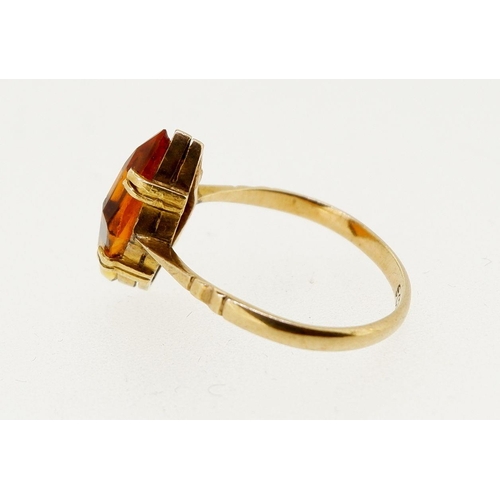 451 - A 9 carat gold ring set lozenge form topaz, size M