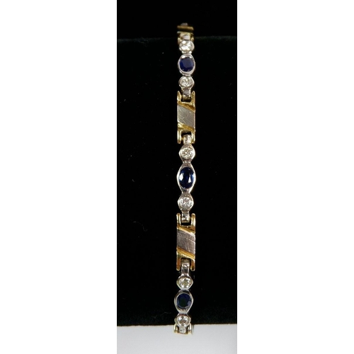 459 - An 18 carat white and yellow gold bracelet set sapphires and diamonds, 18cm, 13g