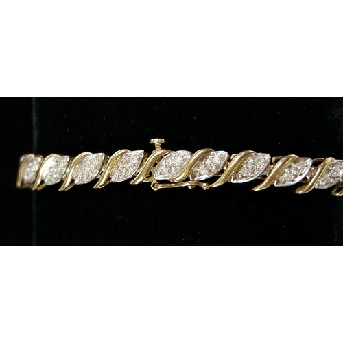 460 - A 9 carat gold bracelet set 58 round cut diamonds (each approx 1.3mm), 18cm, 8.4g