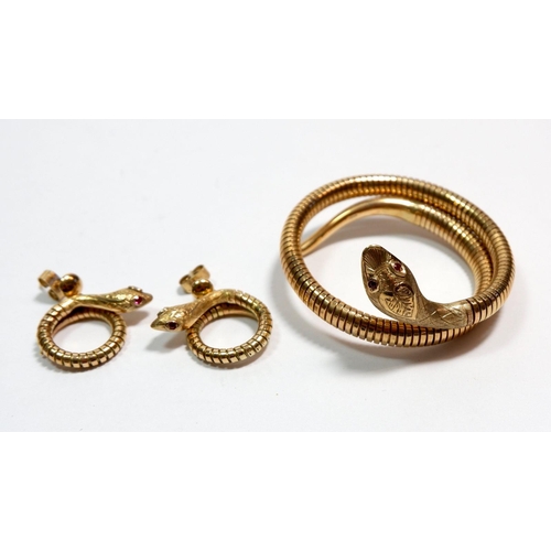 496 - A vintage 9 carat gold coiled snake bracelet and pair of matching earrings all set ruby eyes, 32g, a... 