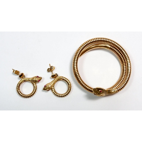 496 - A vintage 9 carat gold coiled snake bracelet and pair of matching earrings all set ruby eyes, 32g, a... 