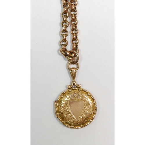 501 - A Victorian 9 carat cold circular engraved locket on 9 carat gold chain 12.2g total weight, 42cm lon... 