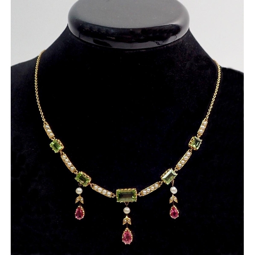 509 - A Victorian gold pendant necklace in suffragette colours set seed pearls and peridot, with three pea... 