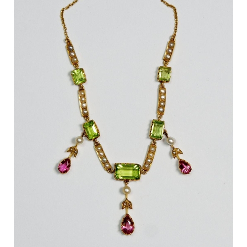 509 - A Victorian gold pendant necklace in suffragette colours set seed pearls and peridot, with three pea... 