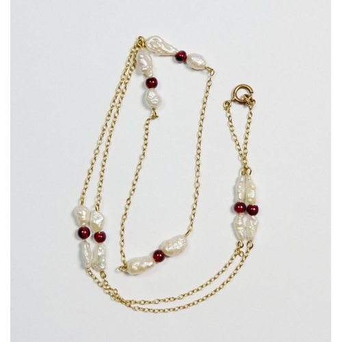 511 - A 9 carat gold freshwater pearls and garnet necklace