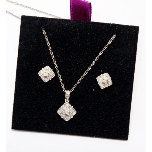 528 - A silver pendant and earrings set diamonds - boxed