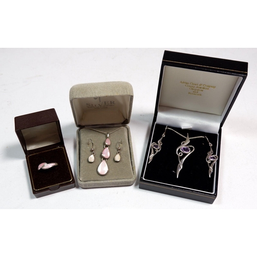 558 - Two silver necklace and earring sets and a ring