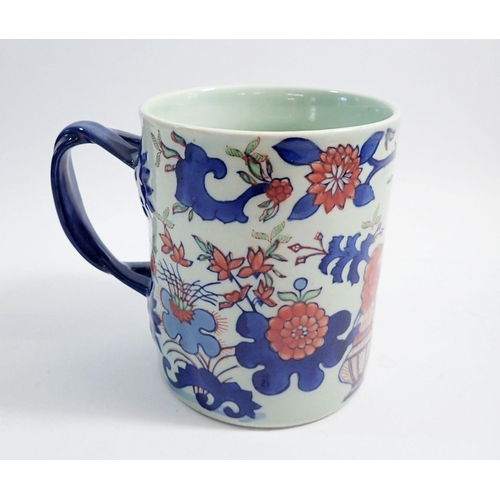 57 - A large Ironstone china mug with twist handle, 15cm high