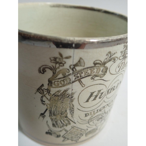 61 - A Sunderland silver lustre 'Husbandmans' mug 'Diligence Provides Bread' a/f, 9 cm tall