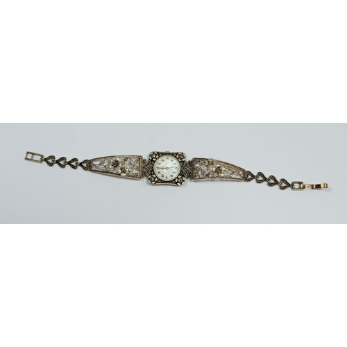 627 - A Brooks & Bentley silver marcasite bracelet watch