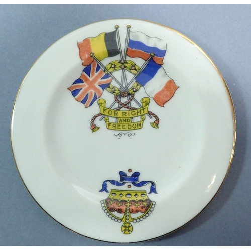 65 - A WWI Armistice Day child's tea service comprising teapot, milk jug and four cups and saucers