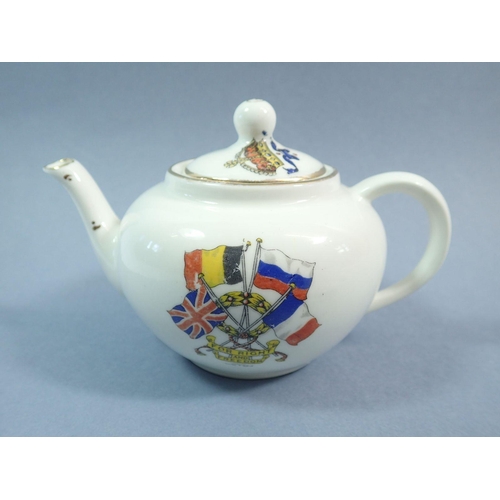 65 - A WWI Armistice Day child's tea service comprising teapot, milk jug and four cups and saucers