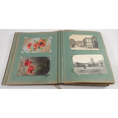 713 - A box of postcards to include two albums of mainly topographical cards plus a loose collection of Sc... 