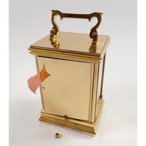 728 - A Woodford brass carriage clock, 14cm tall