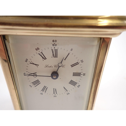 730 - A London Clock Co carriage clock with French movement and key, 11cm