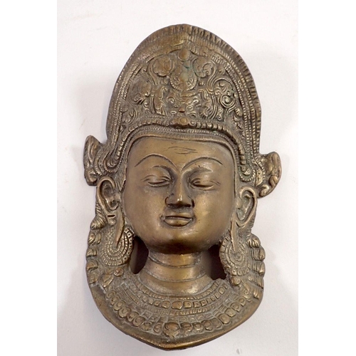 750 - A Thai brass wall mask, 18.5cm long