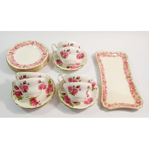 76 - A Foley 'Century Rose' set of six cups and saucers decorated roses and a similar Royal Doulton rose ... 