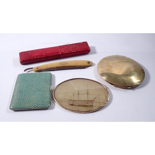 786 - A shagreen style cigarette case, a brass compact, a brass framed photograph of a ship and a cut thro... 