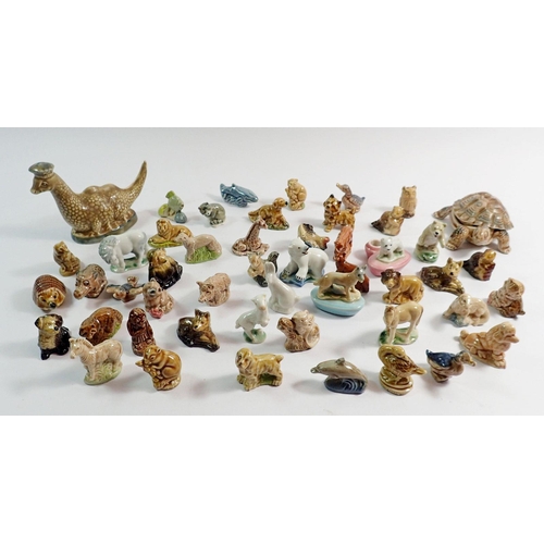 79 - A quantity of Wade Animals and a Beswick Nessie flask