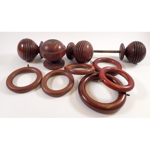 791 - A box of 19th century wooden curtain rings and turned finials