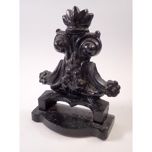 795A - A Victorian cast iron doorstop, 22cm tall