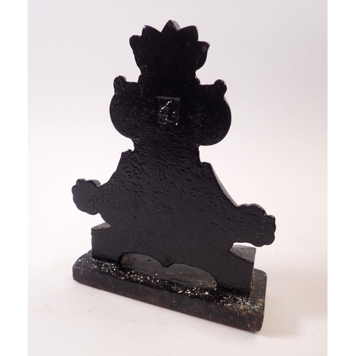 795A - A Victorian cast iron doorstop, 22cm tall