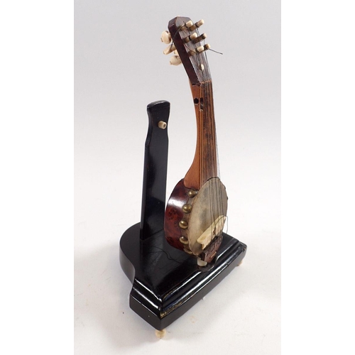 796 - A miniature walnut model of a banjo with bone mounts, 19cm tall