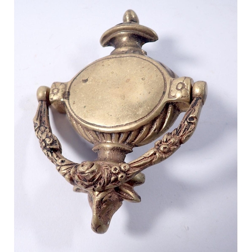 797 - A brass rams head door knocker, 15cm tall