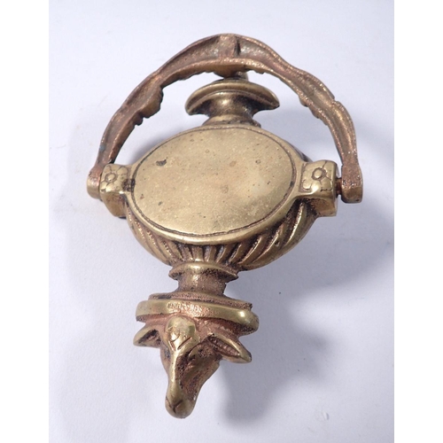 797 - A brass rams head door knocker, 15cm tall