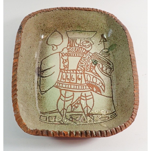 80 - A studio pottery dish with Jack of Spades sgraffito decoration, 28 x 24cm