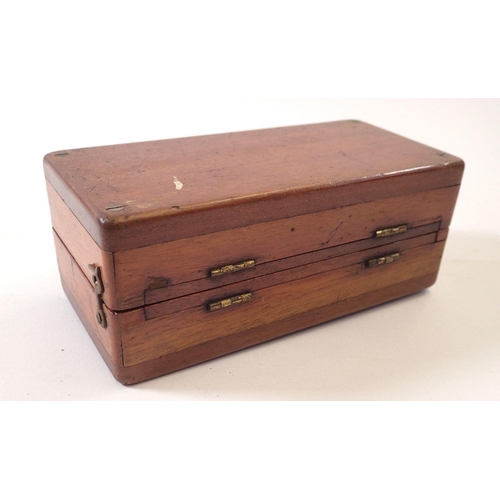 800A - A mahogany cased travelling chess set with bone pieces (2 missing), circa 1900