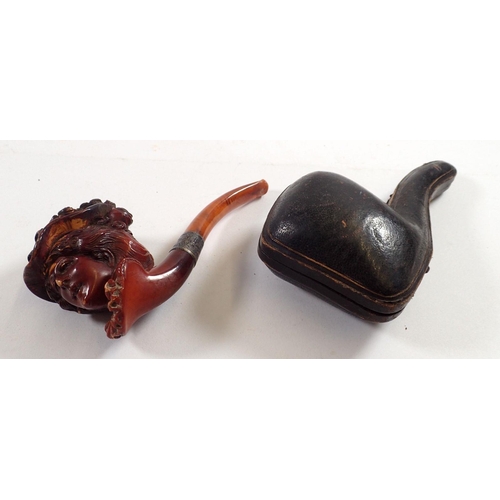 802 - A 19th century Meerschaum pipe in the form of a ladies head with silver collar and amber mouthpiece,... 