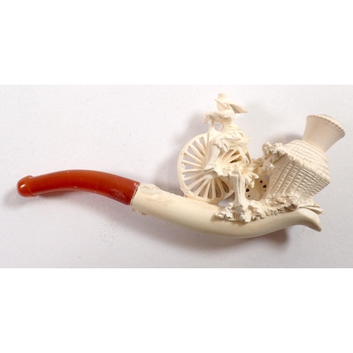 804 - A Meerschaum pipe showing woman on a penny farthing bicycle, with amber mouthpiece, 10cm x 5cm appro... 