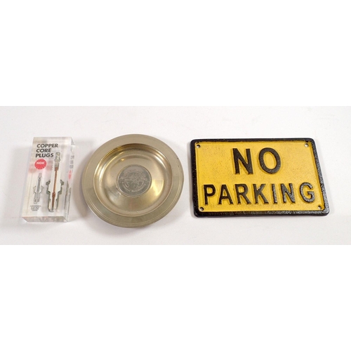 810 - A Silverstone commemorative dish, a Copper Core NGK spark plug perspex promotional item and a No Par... 