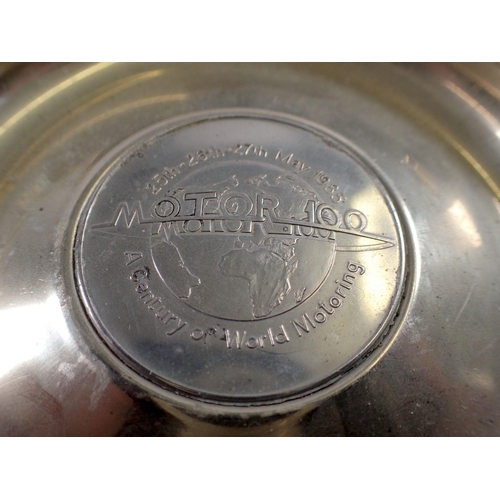 810 - A Silverstone commemorative dish, a Copper Core NGK spark plug perspex promotional item and a No Par... 