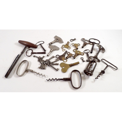 814 - A box of various antique keys, corkscrews and a vintage cheese tester