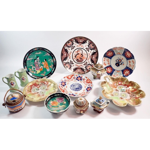 82 - A collection of Japanese ceramics including two Imari plates, various incense burners and a pair of ... 